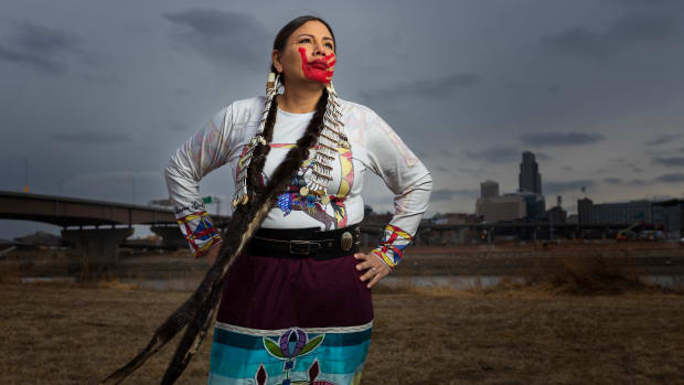 Lestina Saul-Merdassi of Omaha, Nebraska, poses for a portrait with the city of Omaha as the backdrop on Saturday, Feb. 5, 2022. Saul-Merdassi, Sisseton Wahpeton Oyate, grew up in Yankton, South Dakota, gleaning pieces of her Native history through museum artifacts. (Photo by Ryan Soderlin for the Flatwater Free Press)