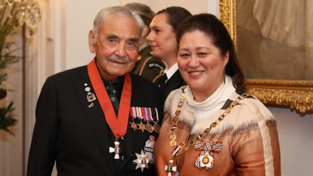 Sir Robert "Bom" Gillies, the last survivor of the Māori Battalion that served in World War II, stands with New Zealand Governor-General Cindy Kiro, who made him a Knight of the New Zealand Order of Merit on May 4, 2022. Gillies took the opportunity to speak out for recognition for the battalion, which he said was poorly treated. (Photo via the Office of the Governor-General of New Zealand)