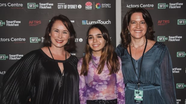 Seventeen-year-old filmmaker Kara Rose, center, won the inaugural First Nations Award at the Aussie SmartFone FlickFest in Sydney, Australia, for her short documentary, "Eight Minutes and Forty Six Seconds," based on the time a police officer kept his knee on George Floyd's neck before he died. The film also draws attention to the Indigenous people who have died in custody in Australia. She is shown here with Angela Blake and Alison Crew, co-founders of the SF-3 organization. (Photo by Angus Platt, courtesy of SF-3)
