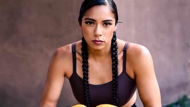 Jayli Fimbres, of the Mandan, Hidatsa and Arikara Nation, has gone from modeling to the boxing ring, modeling Lauren Good Day fashion designs at the Santa Fe Indian Market on Aug. 22, 2022, and debuting with her first professional boxing fight on Sept. 17, 2022. (Photo by Tru Hale, courtesy of Lauren Good Day)
