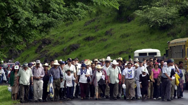 Demonstrators march against the illegal felling of trees in Las Flores, Honduras, 13 miles east of Tegucigalpa, Honduras, on June 29, 2004. Honduras has now signed an agreement - the first of its kind in the Americas - to limit the sale of timber and other products only to wood that has been legally removed.  The agreement went into effect Sept. 1, 2022. (AP File Photo/Ginnette Riquelme)