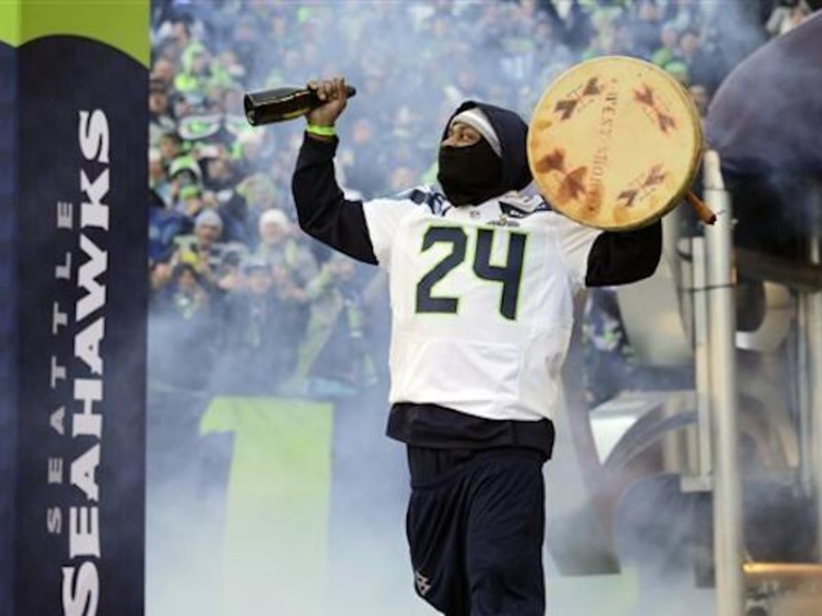 Beast Mode Marshawn Lynch Beats Lummi Fan s Drum in Seahawks Victory Parade ICT News