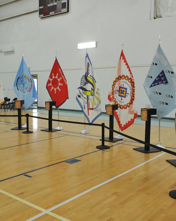 An exhibit including a display of the tribal flags from the Cheyenne River, Crow Creek, Oglala, Rosebud, Sisseton Wahpeton, Standing Rock and Yankton Sioux Tribes. (Rapid City Journal File photo)