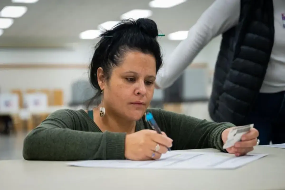 Ginger Morigeau fills out her provisional ballot at the Ronan Community Center on Election Day. (Antonio Ibarra, Missoulian)