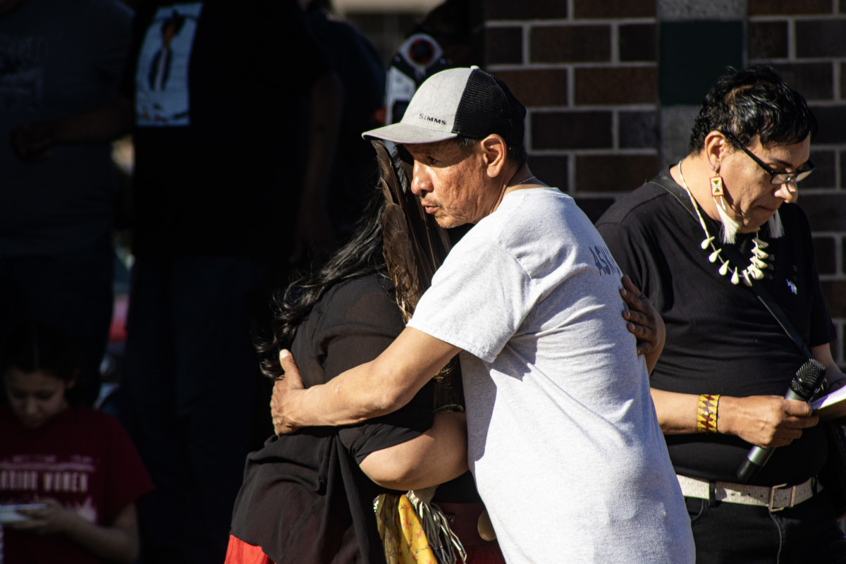 Members of the Brings Plenty family embrace during a vigil in honor of Cole Brings Plenty on April 14 in Rapid City. (Photo by Amelia Schafer, ICT/Rapid City Journal)