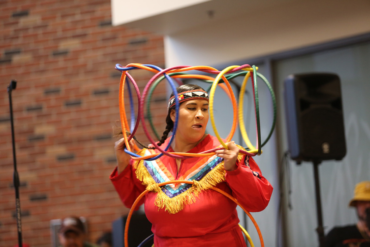 Starr Chief Eagle dances a hoop dance at a Bethel University block party event on April 26. She uses 22 hoops to tell the story of her life. (Bella Haveman, special to ICT)