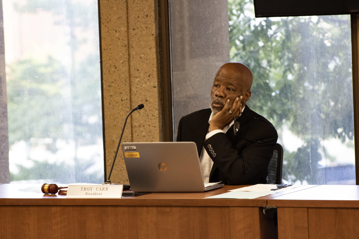 Board President Troy Carr listens as community members voice their thoughts about Superintendent Nicole Swigart's proposed termination. (Photo by Amelia Schafer, ICT/Rapid City Journal)