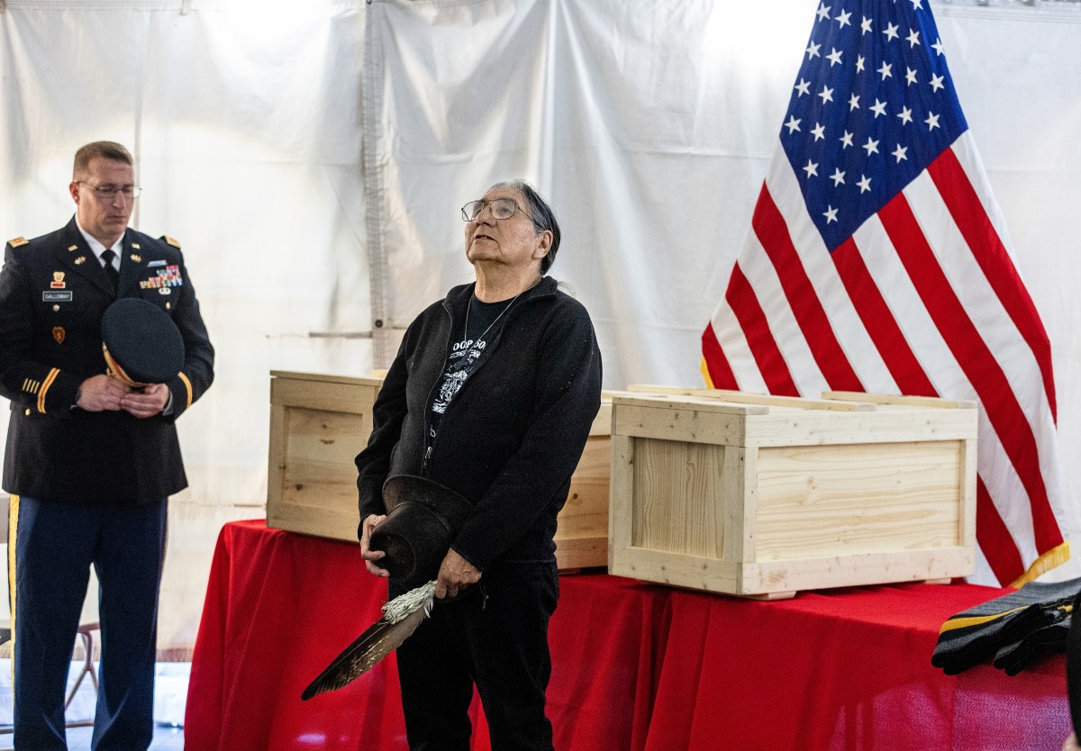 Elder Eugene Black Crow Sr. speaks before praying at the distinguished transfer ceremony on Sept. 10, 2024, in front of caskets of three Oglala Sioux students who died at Carlisle Indian Industrial School in Pennsylvania more than 100 years earlier. The remains of Fannie Charging Shield , Samuel Flying Horse, and James Cornman were returned to the Oglala Sioux in Pine Ridge for reburial. (Photo by Charles Fox, special to ICT)