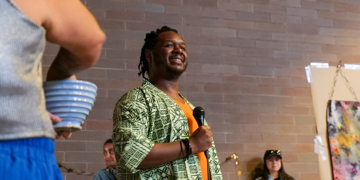 Trae Middlebrooks, illustrator of “Cosmo, From the Stars,” shared a few words with the crowd during the book launch and reading that was held at Barbie's Village on Sept. 14, 2024. (Photo by Jarrette Werk Underscore Native News / Report for America)