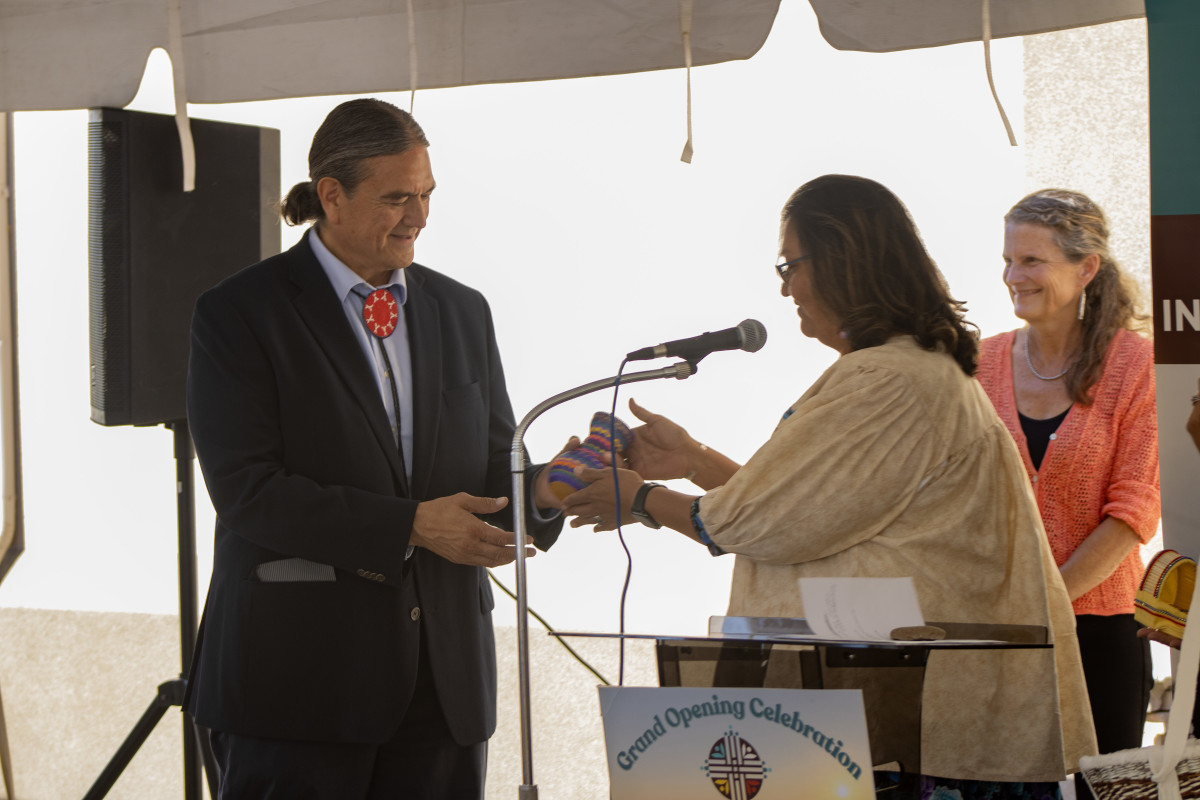 Don Warne accepts a beaded vase during the grand opening of the Johns Hopkins Center for Indigenous Health Great Plains Research Hub in Rapid City. (Photo by Amelia Schafer, ICT/Rapid City Journal)