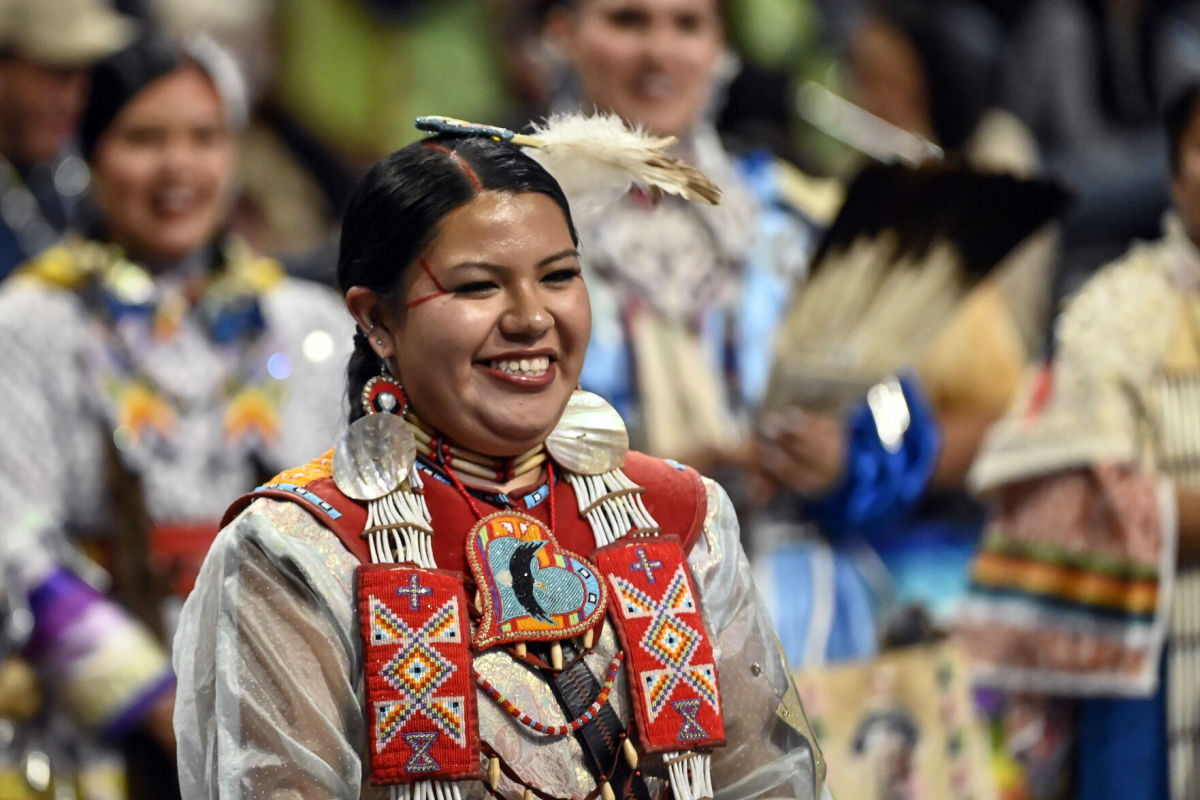 Wanbli Waunsila Wi Eagle smiles as she is crowned miss He Sapa Win during the 2023 He Sapa Wacipi in Rapid City. (Photo by Matt Gade, Rapid City Journal)