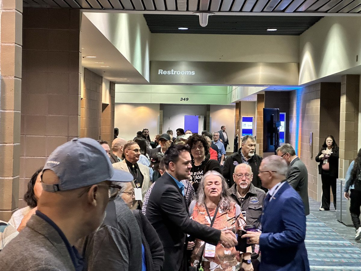 Members of the National Congress of American Indians lined up at the polls Thursday morning at the 80th annual NCAI convention, hosted in New Orleans, Louisiana this year. Voting topics included the race for the new presidential election and two proposed constitutional amendments that would exclude state recognized tribes from voting membership. (Photo Courtesy of Eddie Sherman)