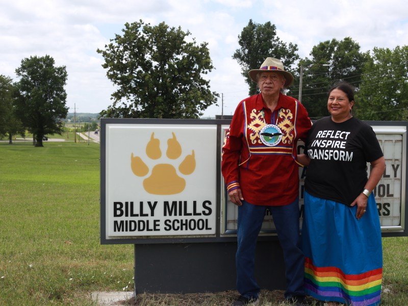 (Left to right) Steve Cadue and daughter Carole Cadue-Blackwood pose outside of the Billy Mills Middle School in Lawrence, Kans.