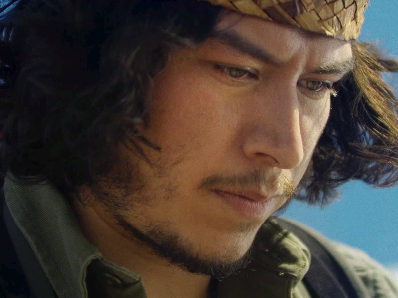 Native man looking down from documentary ceremony