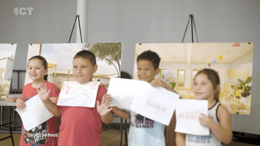 Caddo Indian Nation students in Oklahoma share drawn photos at event showing photos of new childcare center