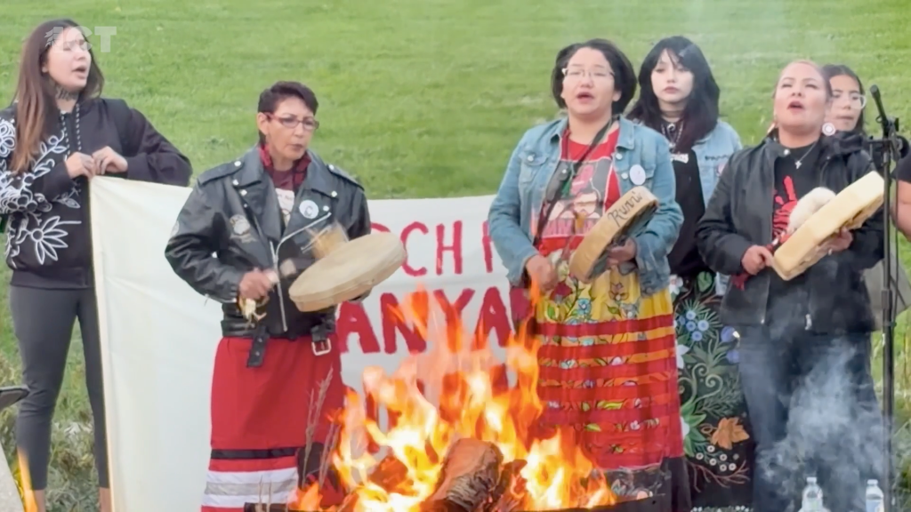 family and friends of Tanya Nepinak play drums around fire after memorial walk to bring awareness that Nepinak's remains have not been recovered